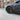 Side view matte black multi-spoke 19-inch wheel cover with center cap