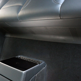 Second-row seat protector with black textured surface and armrest pass-through