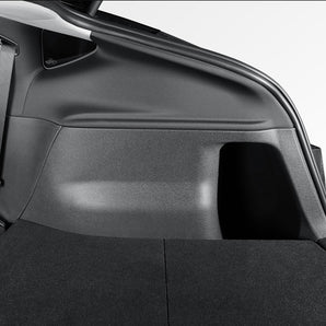 Black TPE trunk side protector panel installed along rear cargo side wall.