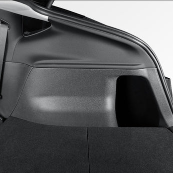 Black TPE trunk side protector panel installed along rear cargo side wall.