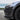 Matte black fog light trim cover on a Model Y front bumper corner