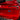 3D alloy performance badge on red car trunk, rectangular blue and silver starburst