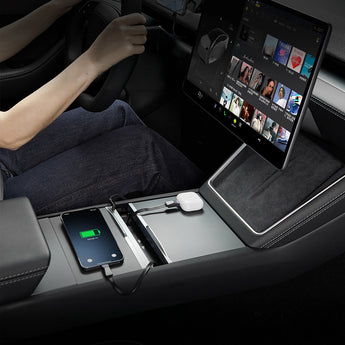 Retractable charging hub installed in console with phone charging and cable connection