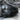 Glossy black front lip spoiler fitted on a Tesla front bumper