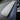Alcantara dash trim cover with blue accent strip over textured grey surface