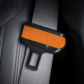 Seat belt wrap sticker set in mango orange, textured oval pad with black top strip.