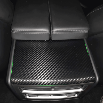 Carbon fiber rear air vent cover panel with carbon-weave pattern and outlet grille