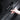 Hand applying a black carbon-fiber scuff protector labeled “MODEL Y”