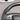 Carbon fiber steering wheel rim detail with perforated leather grip and control area