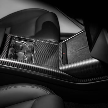 Carbon fiber console side trim with dark weave texture near center console