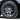 Silver wheel hub cap with star-spoke cutouts on dark alloy rim