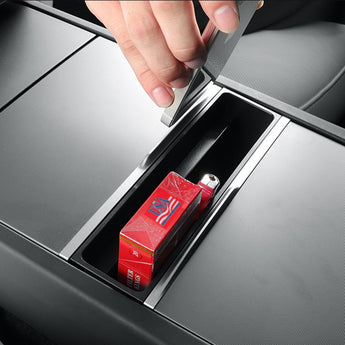 Dark gray console organizer tray holding boxes inside an open phone slot