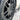 Close-up of gray octagonal wheel center with round hub cover