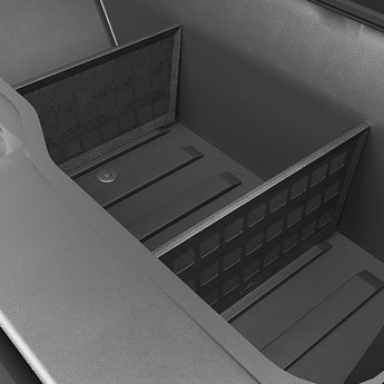 Installed subtrunk divider with raised edges and rectangular grid openings