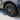 Black wheel rim protector edge fitted around a multi-spoke alloy wheel