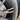 Close-up of a dark gray rim protector lip near an alloy wheel spoke