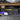 Truck bed cargo divider with MOLLE panel and mounted tools and accessories