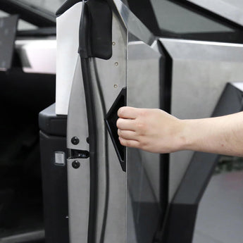 Cybertruck inside door handle trim in black molded silicone, hand opening door