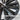 Cyclone-style hubcap close-up: smooth spoke surfaces with clip and valve area