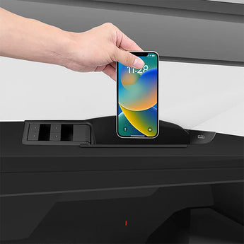 Smartphone placed in black door storage organizer tray for Tesla Cybertruck