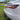 Dynamic full-width LED taillight bar on white Tesla rear with red glowing strip