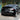 Glossy black rear spoiler wing on the rear of a Tesla Model Y