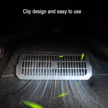 Under-seat vent cover installed, silver frame with black slat grille