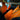 Orange custom-fit car seat covers with quilted center panels and headrest cutouts