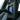 Car armrest storage box in rear seat, lid open showing blue insert