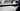 Glossy carbon-fiber door trim along interior door handle area