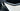 Interior door trim, glossy black carbon-fiber style, close-up on door panel edge