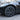 Dark wheel cover set with multi-spoke center hub on a car wheel