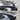 Rear trunk spoiler wing with glossy black finish for aerodynamic styling on a car