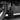 Black front mud flap with circular mounting hole, shown beside tire