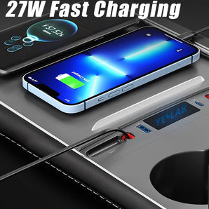 Gray USB hub with built-in ports for fast charging and retractable cables connected to devices.