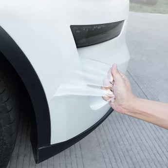Clear TPU film being applied to white bumper corner