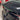 Dark black rear trunk spoiler lip on gray car, angled side view