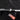 LED puddle light projector casting red and white striped badge on car door sill