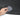 Black trunk sill protector with ribbed grip texture; hand wipes with a gray cloth