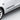 Black graffiti-style decal sticker applied along the side of a white car