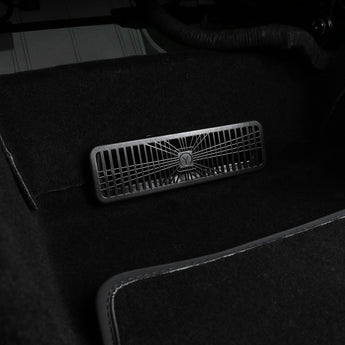 Black under-seat air vent cover with Y emblem and grid grate, molded ABS plastic
