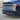 Black blade-style rear spoiler with side fins near the taillights.