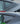 Black racing-style rear quarter window louver trim with curved slat design