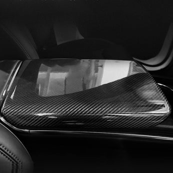 Installed dark carbon fiber armrest cover with reflective woven texture