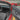 Carbon fiber door panel trim with green accent line on front interior door