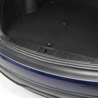 Installed carbon fiber trunk sill protector with dark weave and rectangular cutout