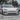 Carbon fiber V-style front lip splitter on silver Tesla Model 3 front