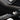 Close-up view of real carbon fiber texture on Tesla Model Y center console side Panel Covers