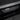 Carbon fiber door sill cover with silver trim and textured weave insert