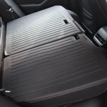 Second-row seat back protector with gray ribbed surface and attachment clips
